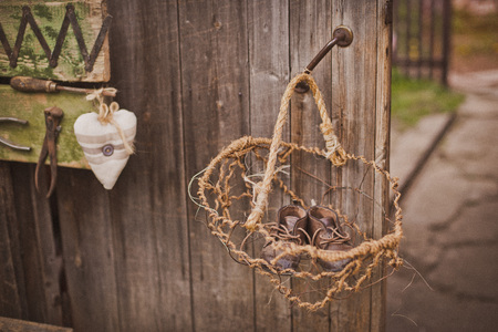 design of the photo zone in a rustic style, old wooden doors and boards with tools and spring flowers. Art space in the garden. the gardeners workshopの写真素材