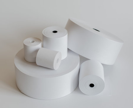Roll of cash register tape isolated on soft gray background.High resolution photo.