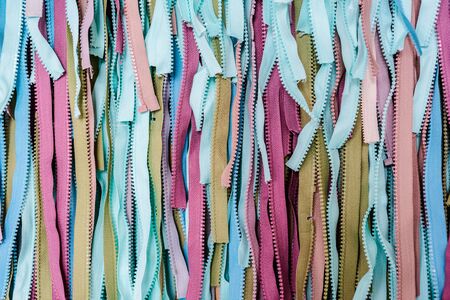 Turquoise blue and multicolored fabric texture material textile zipper macro blur abstract background, space for text.の写真素材