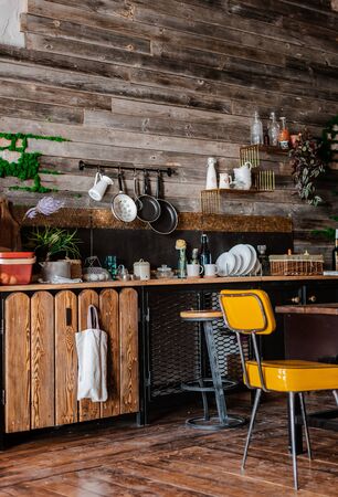 interior and design of modern home kitchen in rustic style. In the background is a wall of wooden planks.の写真素材