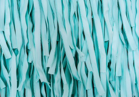 Turquoise blue fabric texture material textile zipper macro blur abstract background, space for...