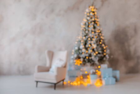 Unfocused silhouette of a Christmas tree with blurred lights. Background for congratulations new year 2020. Free space for text.の写真素材