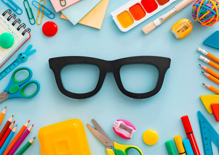mock-up Flat-lay stationery chalk board eyeglass frames on a white background of the table,...