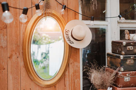 interior of the summer country cozy wooden rustic terrace with vintage accessories furniture. Atmospheric interior room for summer vacation in the country.の写真素材