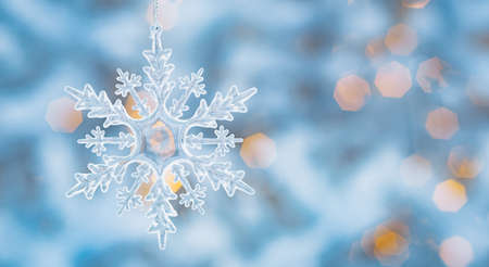Winter snow background abstract bokeh. Snowflake Close-Up. Free space for text. Christmas, New Year.の写真素材