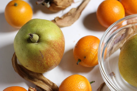 Fruits of pear and kumquatの写真素材