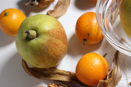Fruits of pear and kumquatの写真素材