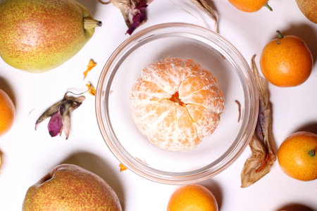 Orange kumquat fruit in glass bowlの写真素材