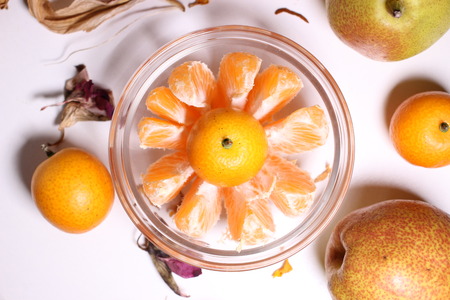 Orange kumquat fruit in 
glass bowlの写真素材