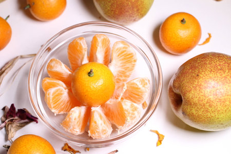 Kumquat fruit in glass bowlの写真素材