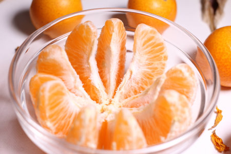 Kumquat fruit in glass bowlの写真素材