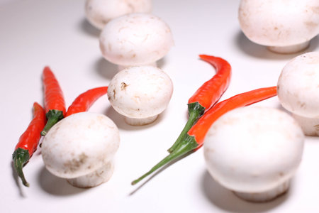 Food ingredients - mushrooms and chiliesの写真素材