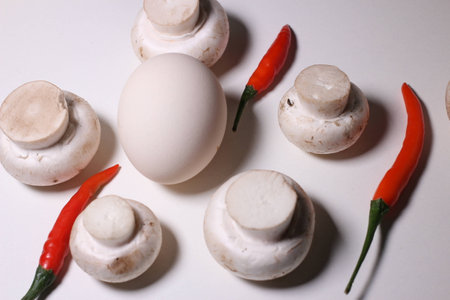 Food ingredients - egg, chilies and mushroomsの写真素材