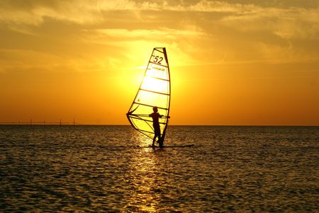 Sunset and windsurfing on the Black sea, Sochi, Russia                 の写真素材