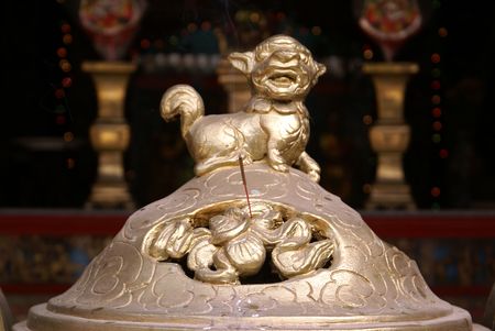 Bronze lion on the shrine in buddhist temple in Vietnam              の写真素材