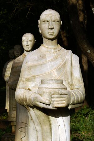 Statues of buddhist monks in the forest, Hsipo, Myanmar             の写真素材