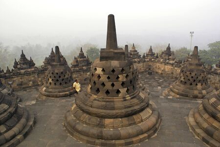 Stupas and tourist in Borobudur, Java, Indonesia                  の写真素材