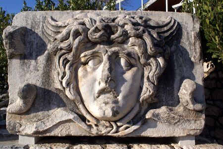 Stone face of man on ruins of Apollo temple, Didim                 の写真素材