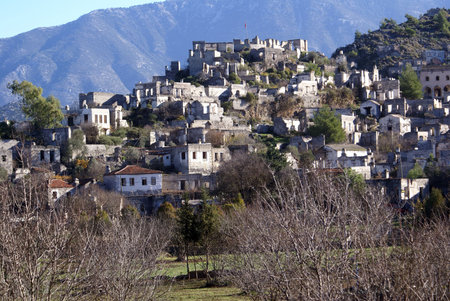 Orchard and ruins of houses in village Kayakoy near Fethie, Turkey                 の写真素材