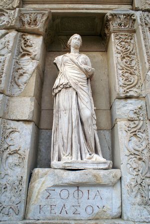 Statue and facade of library in Ephesus, Turkey               の写真素材