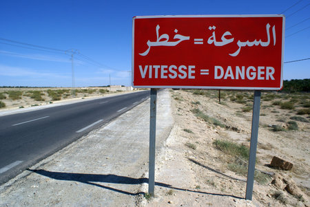 Red sign danger on the road in south part of Tunisia                の写真素材