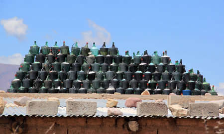 Group of wine bottles on the roof of house in arid climateの写真素材
