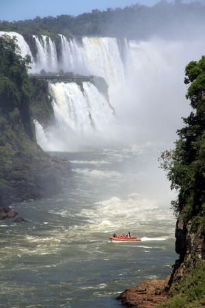 Boat, rocks and Iguazu falls in Argentinaの写真素材