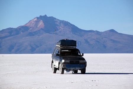 Four wheel drive car in the Salt desert Uyuni in Boliviaの写真素材