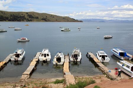 Boats on the lake Tititaca in Copacobanaの写真素材