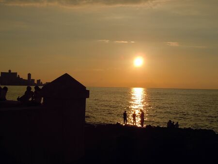 People and fishing on the coast in Havana, Cuba           の写真素材