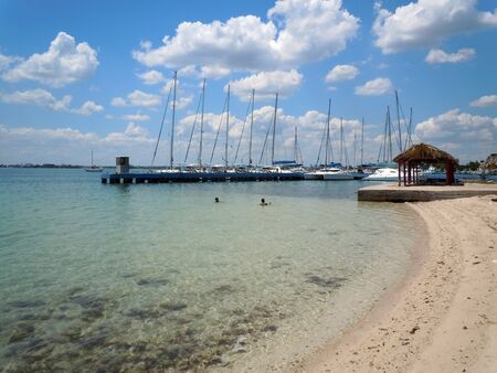 Sand beach and marina on the coast in Sienfuegos, Cuba          の写真素材