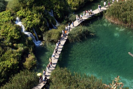 Tourists on the footpath in Plitvice park, Croatia           の写真素材