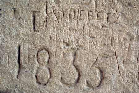 Old graffiti on the stone of roman theater in El-Jem, Tunisia                 の写真素材