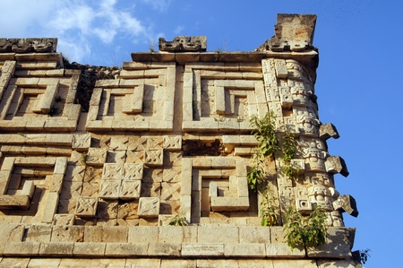 Corner of palace with mayan god Chak in Uxmal, Mexico                  の写真素材