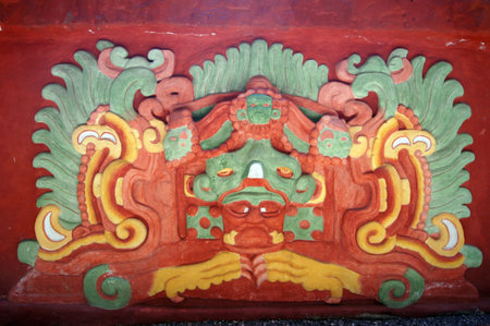 Color mayan god on the wall of old pyramid in Copan museum, Honduras                      
