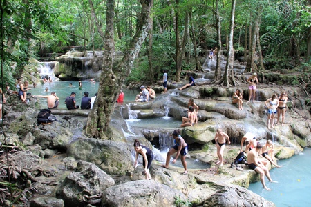 ERAWAN WATERFALL, THAILAND - CIRCA AUGUST 2011 - A lot of people come to relax on the waterfal Erawanのeditorial素材