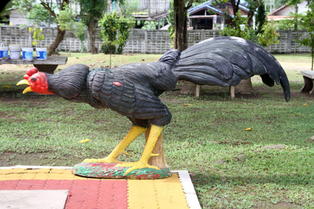 Big black rooster statue in the buddhist monsastery, Thailandの写真素材