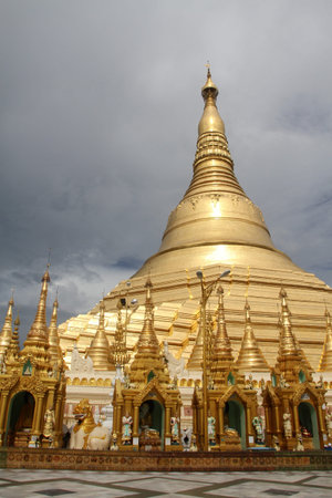 Dark cloud on the sky and Shwe Dagon pagoda in Yangon, Myanmarの写真素材