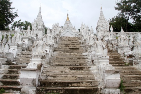 Staircase with white dtatues on the bank of river in Mingun, Myanmarの写真素材