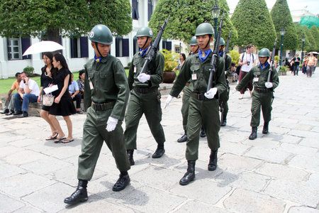 Soldiers walk inside territory of Grand palace in Bangkok, Thailand