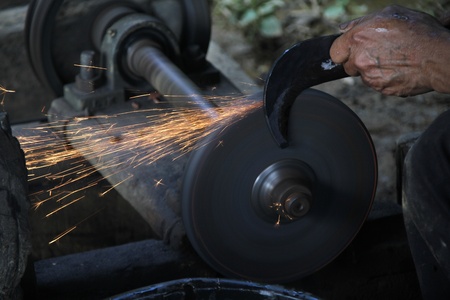Blacksmith worker in the dark room, Phonsavan, Laosの写真素材