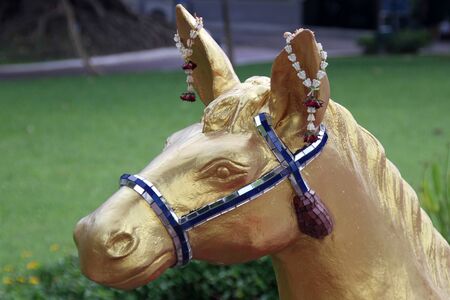 Golden head of horse on the buddhist shrine in Dusit park, Bangkok, Thailandの写真素材