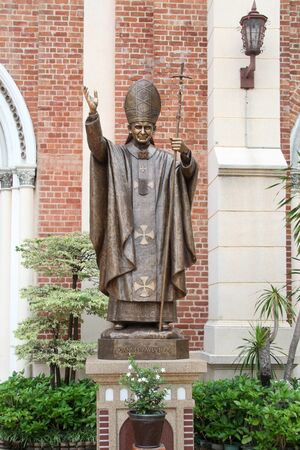 Statue of roman pope Ioann Pavel II near Assumption church in Bangkok, Thailandの写真素材