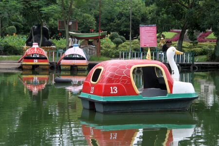 Goose boat on the lake in public park, Yangon, Myanmarのeditorial素材