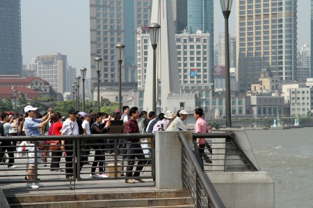SHANGHAI, CHINA - CIRCA APRIL 2012 People on the embankment of river Huangpuのeditorial素材