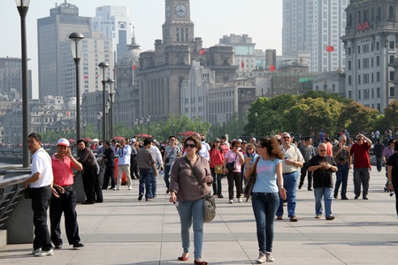 SHANGHAI, CHINA - CIRCA APRIL 2012 Peoplke walking on the embankment in the center of Shanghai, China のeditorial素材