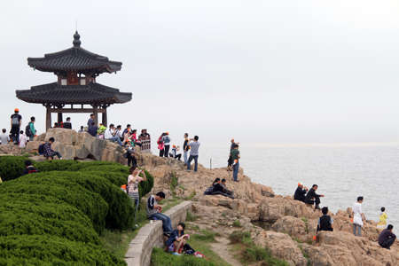 Tourists on the coast of Putoshan island, Chinaのeditorial素材