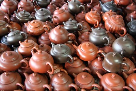 A lot of tea pots on the tableの写真素材