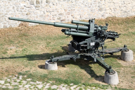 Old big green anti-aircraft gun near the wall of Belgrade fortress, Serbiaのeditorial素材