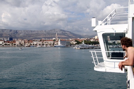 Man looking from the ferry on the Split, Crotiaのeditorial素材